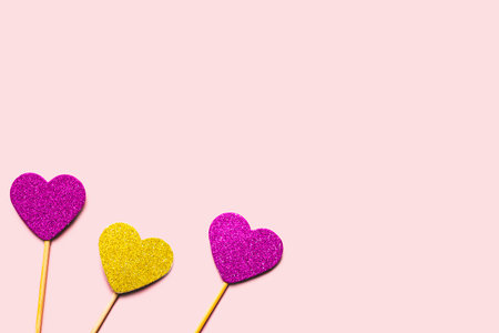 Hearts on a stick of purple and gold colors. Valentine's day concept.の写真素材