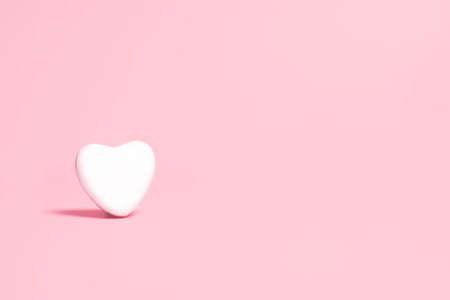 White heart on a pink background. Valentine's day concept.の写真素材