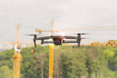 Quadcopter with camera. Aircraft. Drone. A small unmanned quadcopter flies in the skyの写真素材