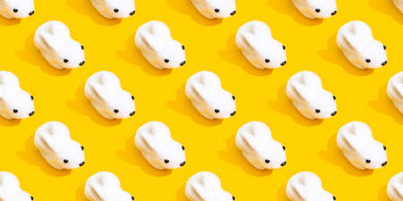 White rabbit on a yellow background pattern.の写真素材