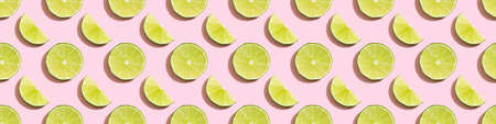 Seamless pattern of limes on a pink background.