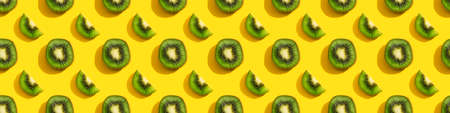 Kiwi seamless pattern on a yellow background.の写真素材