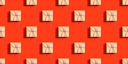 A pattern from gift boxes on a red background.の写真素材