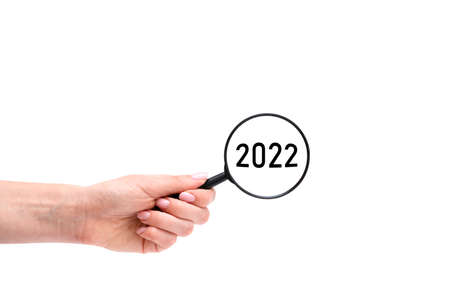 Hand with magnifying glass. 2022 yearの写真素材