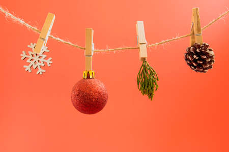 Christmas garlands on a rope on a red background.の写真素材