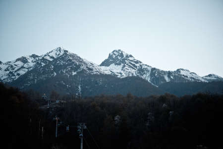 Lift to the snowy mountains above the winter forest.の写真素材