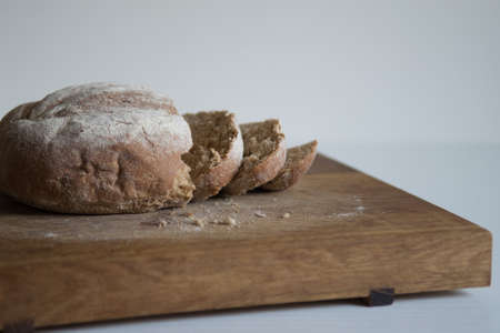 Homemade bread on a wooden board.の写真素材