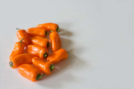 Sweet pepper orange oblong shape on a white background.