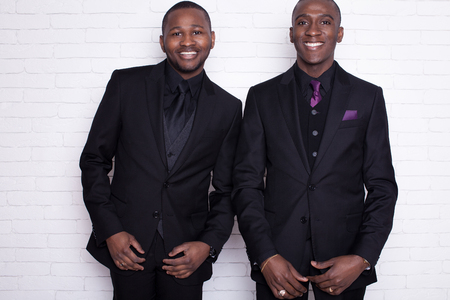 Portrait of a relaxed smiling young Afro man in studioの写真素材