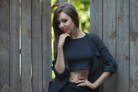 Portrait Of Young Smiling Beautiful Woman. Portrait of a fresh and beautiful young fashion model posing outdoor in sunny weather. woman portrait. smiling girl in city streetの写真素材