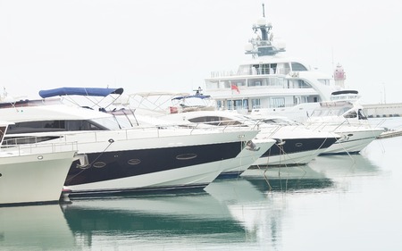Yacht. A luxury yacht at the yacht club in the port. Concept of rich life.の写真素材