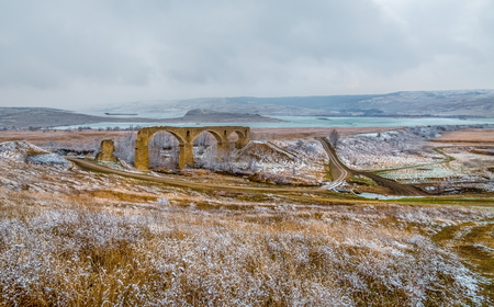 An old railway bridge in the steppe. The German bridge in Russia. History. Ruined and inoperative bridge.の写真素材