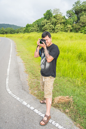 Photographer taking pictures with film cameraの写真素材