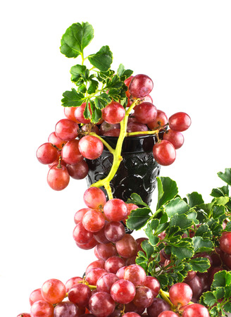 Ripe red grapes with glass isolate, selective focus point.の写真素材