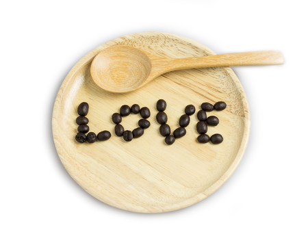 coffee bean love word in wood plate isolateの写真素材