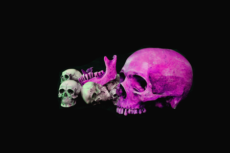 Many head pink skull black backgroundの写真素材
