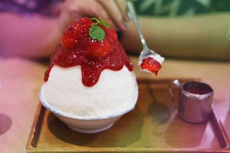 Shaved ice with milk and strawberry jam, ,blur motionの写真素材