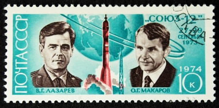 a stamp printed in the ussr shows the cosmonauts v.g.lazarev and o.g.makarov,and soyuz 12,circa 1974の写真素材