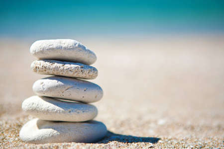 Stack of white stones on tropical beachの写真素材