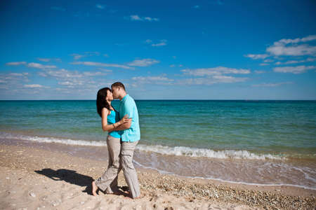 Couple kissing on the beachの写真素材