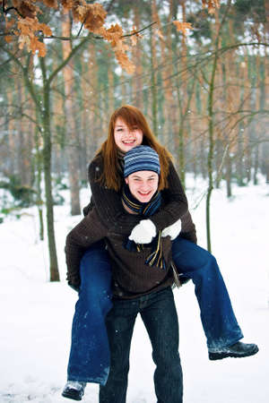 Young couple in love smiling in winterの写真素材