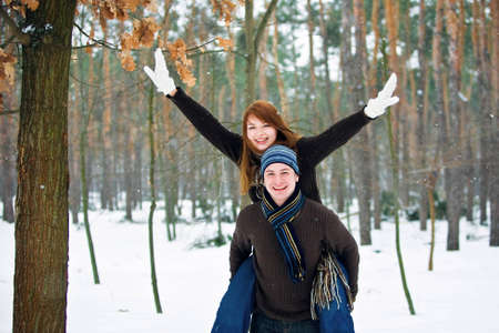 Young couple in love smiling in winterの写真素材