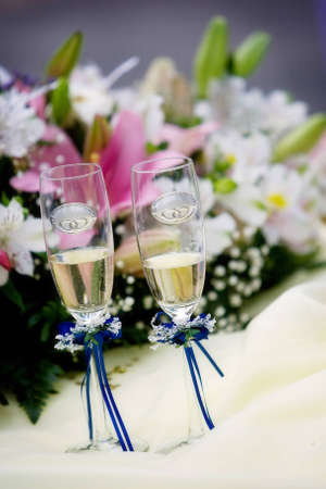 Wedding glasses and a bouquetの写真素材