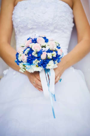 Bridal bouquet in the hands of the brideの写真素材