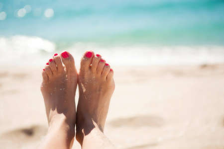 Girls feet in the sandの写真素材