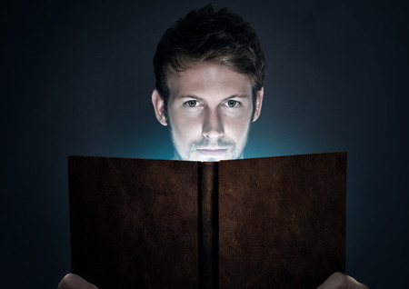 Young man reading books . Conceptual image 