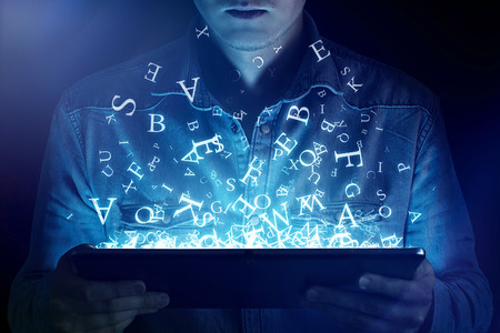 Man reading on an Ebook Readerの写真素材