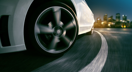 Wheels of a sports car at nightの写真素材