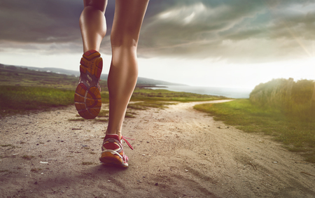 Female Jogger on coastal pathの写真素材