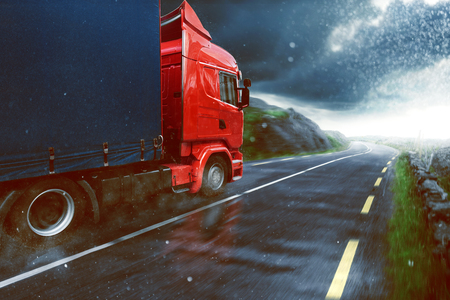 Truck drives during rainの写真素材
