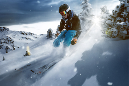 Skier rides through deep powder snowの写真素材