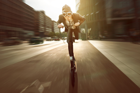 Businessman on a scooter
