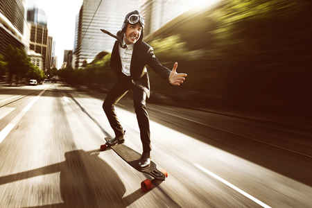 Skateboard with a business dressの写真素材