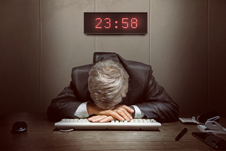 old man Overtime tiredの写真素材