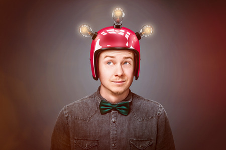 Genius man wearing red helmの写真素材