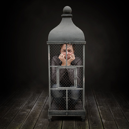 Caged man stay insideの写真素材