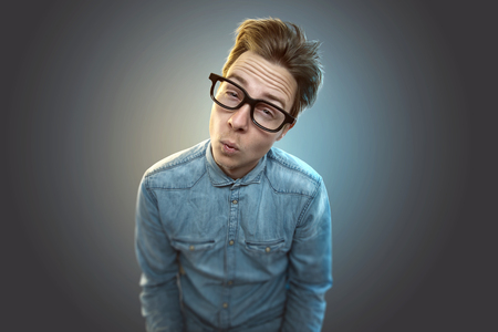Nerd with glasses and blue shirtの写真素材