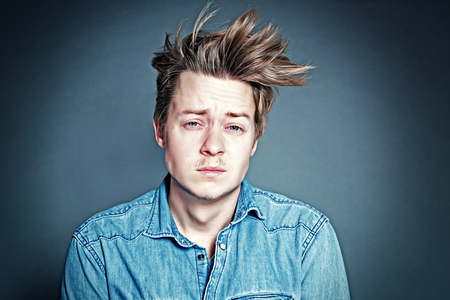 young man with stoned faceの写真素材
