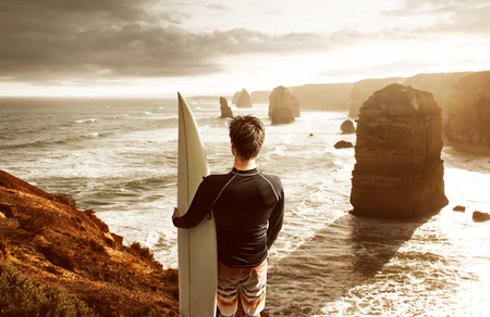 Surfer enjoys the view over the bayの写真素材