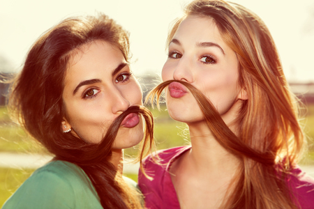 Two girls kid aroundの写真素材