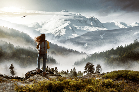 Hiker in front of picturesque landscapeの写真素材