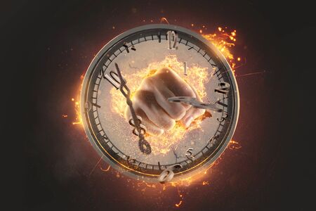 Fist smashing trough a clockの写真素材