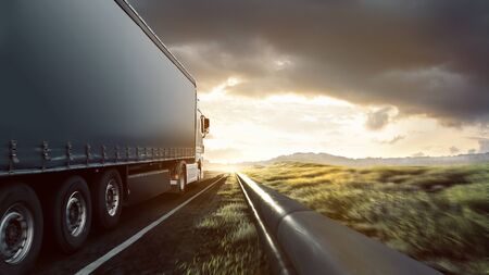 Truck on highway in the sunsetの写真素材