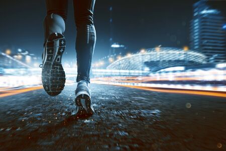 Runner in a night city の写真素材