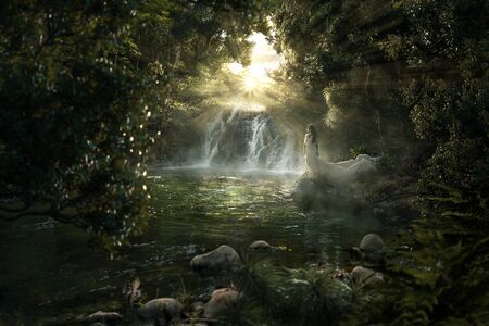 Woman is standing at paradise waterfall in the jungleの写真素材