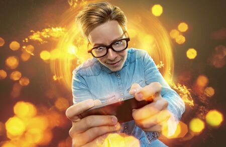 Nerd on his smartphoneの写真素材